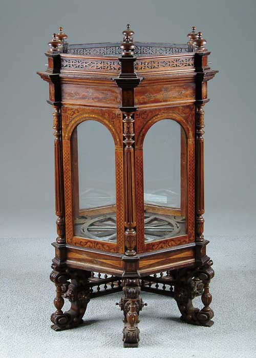 Appraisal: INTERESTING INLAID MECHANICAL TABLETOP DISPLAY CABINET The cabinet is hexagon