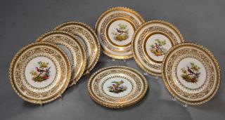 Appraisal: Eight Minton service plates with painted bird centers and ornate