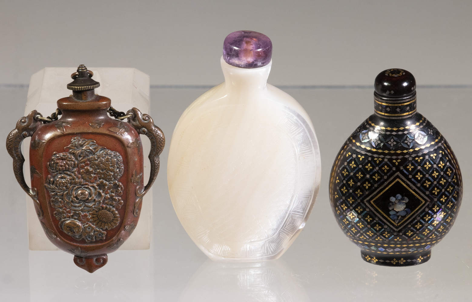 Appraisal: SNUFF BOTTLES Including Carved mother-of-pearl shell bottle amethyst lid and