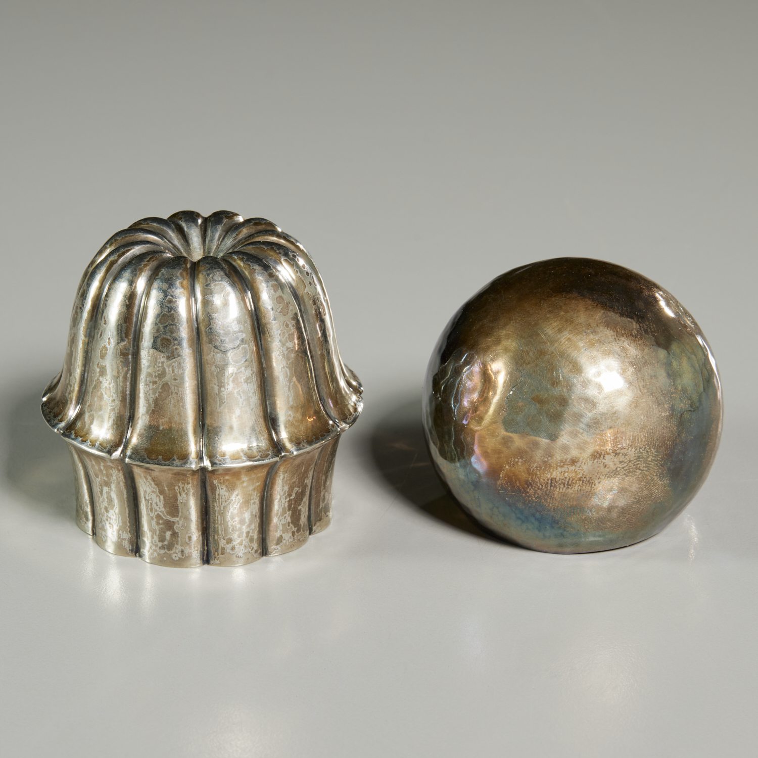 Appraisal: JOSEF HOFFMANN SILVER BOTTLE STOPPERS c Austria one likely silver