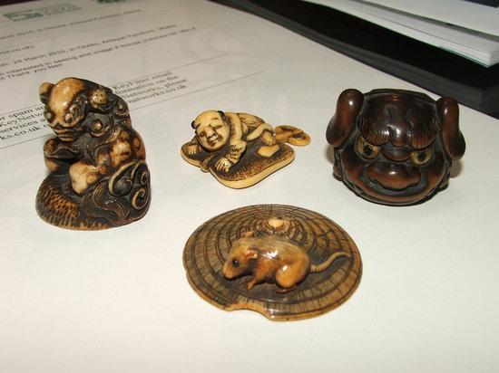 Appraisal: A GROUP OF THREE JAPANESE IVORY NETSUKE and a further