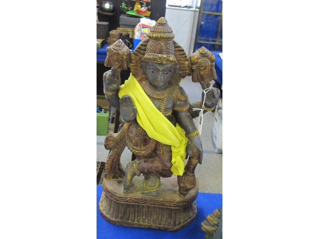 Appraisal: Painted and carved figure of a god