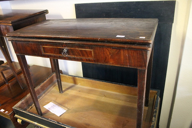 Appraisal: A GEORGE III MAHOGANY RECTANGULAR FOLD OVER TEA TABLE having