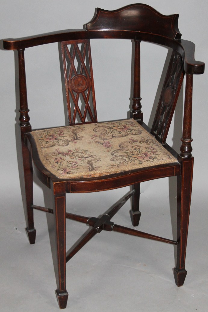 Appraisal: An Edwardian mahogany and boxwood strung corner chair with a