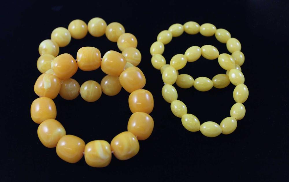 Appraisal: FOUR BALTIC AMBER BRACELETS each stretch bracelet with egg yolk