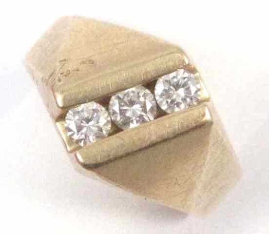 Appraisal: MAN'S DIAMOND AND FOURTEEN KARAT GOLD RING set with three