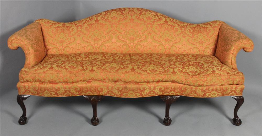 Appraisal: CARVED CHIPPENDALE STYLE CAMELBACK SOFA striated gold and salmon shadow