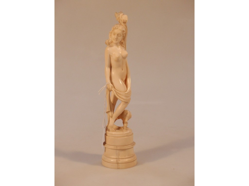 Appraisal: A carved ivory figure of a nude with a peacock