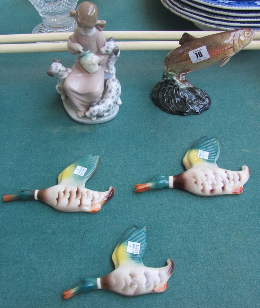 Appraisal: A Lladro figure 'Girl with puppies' a Beswick trout and