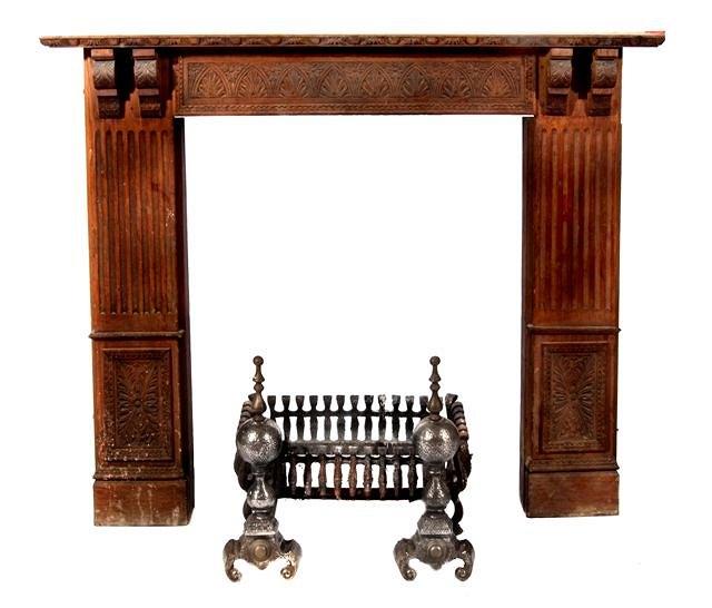 Appraisal: A carved wood fireplace with fluted supports and floral designs