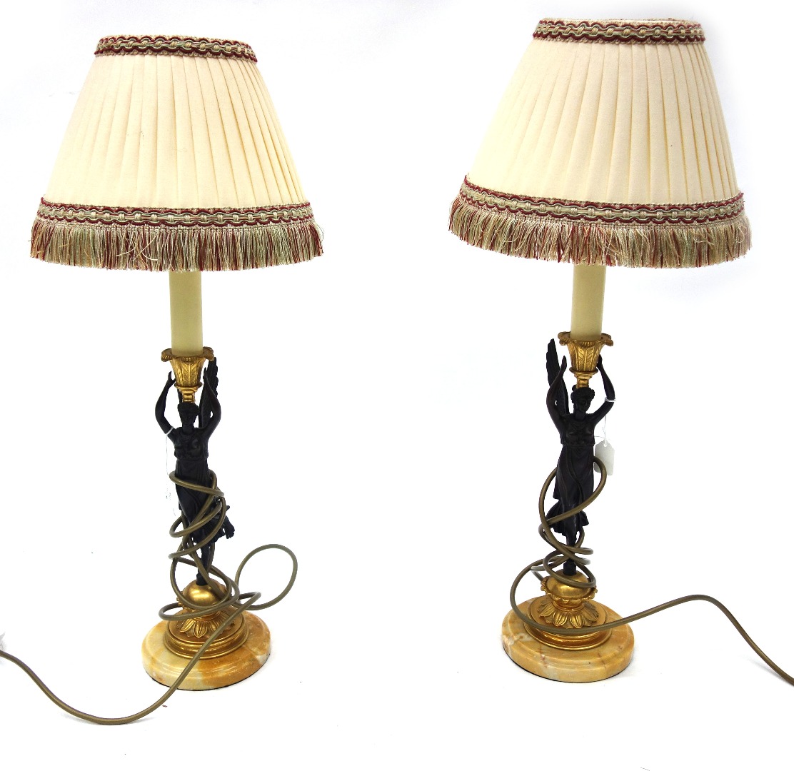 Appraisal: A pair of reproduction Empire style gilt metal and bronzed