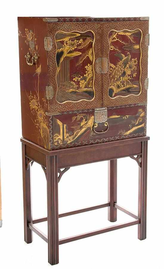 Appraisal: Japanese raised pictorial red lacquer cabinet on stand late th