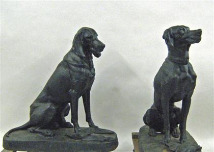 Appraisal: Two large cast iron dogs Each modeled as a seated