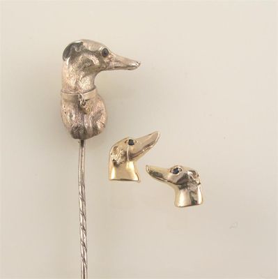 Appraisal: A late Victorian gold stick pin depicting a greyhound or