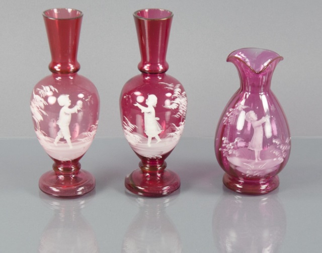 Appraisal: Three Mary Gregory Cranberry VasesIncluding matching pair with white enamel