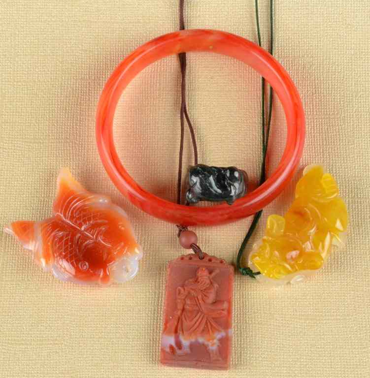 Appraisal: Pieces Chinese Carved Agate JewelryTo include three pendants carved to