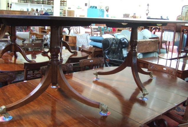 Appraisal: A Regency style mahogany dining table the rosewood cross banded