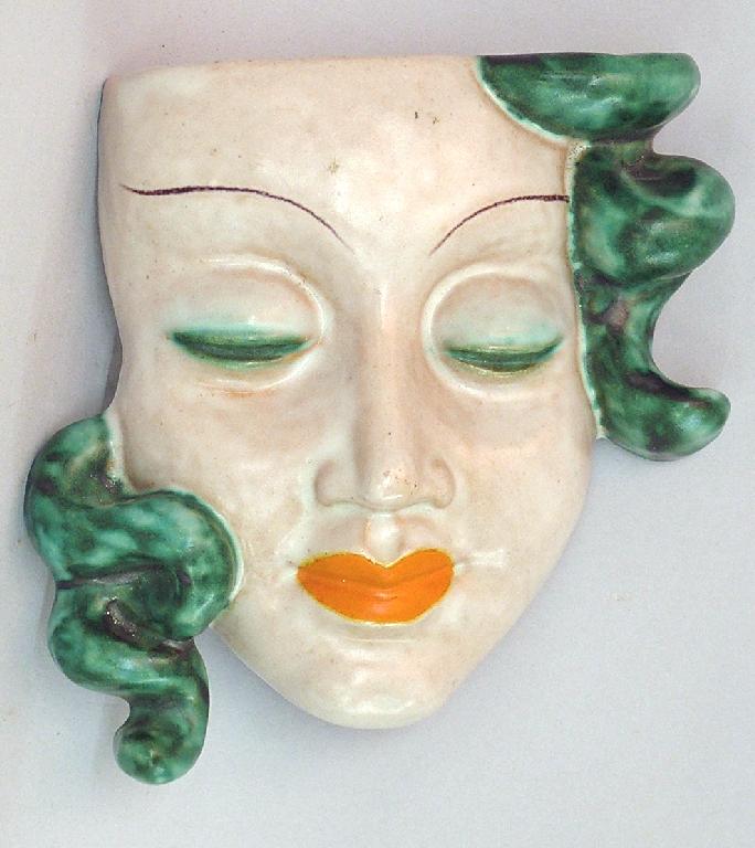 Appraisal: Unusual Goldscheider 's wall mask pocket modelled by Ernest Webber