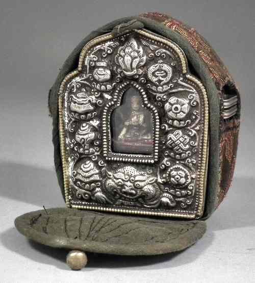 Appraisal: An unusual Tibetan travelling altar inset with figure of a