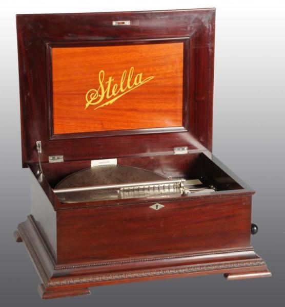 Appraisal: Stella Double Comb Disc Music Box Description Mahogany with discs