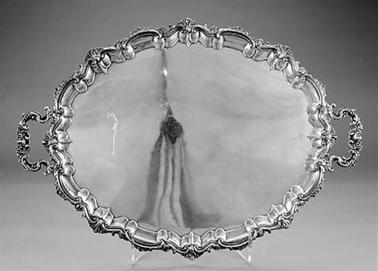 Appraisal: Silverplate serving tray scalloped rim on oval panel flanked by