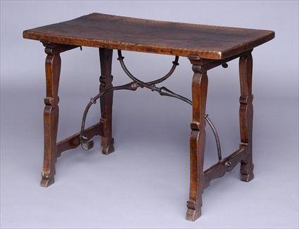 Appraisal: ITALIAN BAROQUE WALNUT TRESTLE TABLE The rectangular single board top