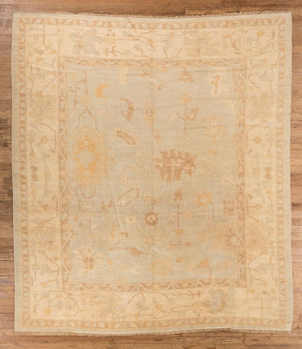 Appraisal: Fine Oushak Carpet light blue and beige ground stylized floral