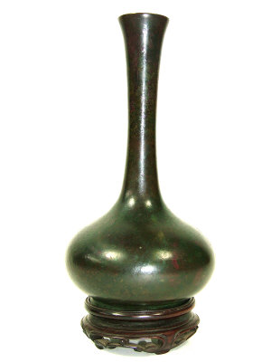 Appraisal: A Chinese brown patinated bronze bottle vase with flared neck