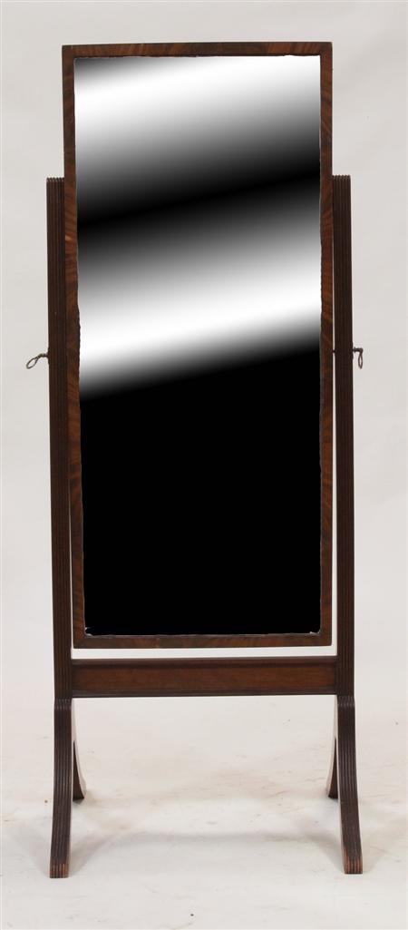 Appraisal: A Regency mahogany cheval mirror the rectangular mirrored plate on