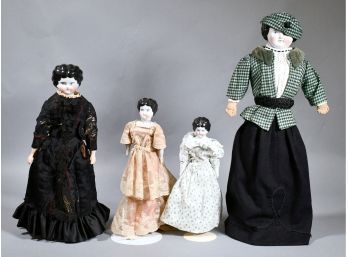 Appraisal: Four fully dressed antique china head dolls with stands including