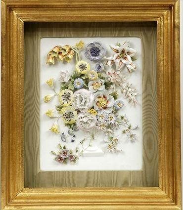 Appraisal: Continental Porcelain Plaque with Applied Flowers In shadow box frame