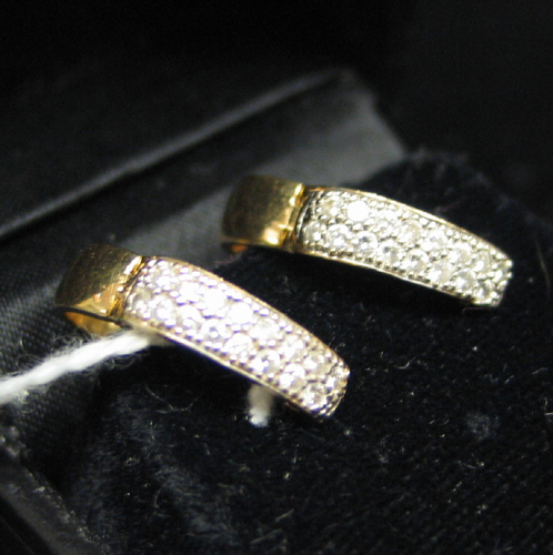 Appraisal: PAIR OF DIAMOND AND FOURTEEN KARAT GOLD EARRINGS each set