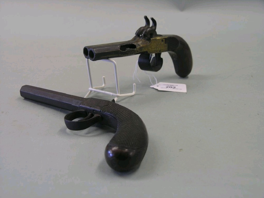 Appraisal: A Georgian double barrelled percussion holster pistol side-by-side barrels in