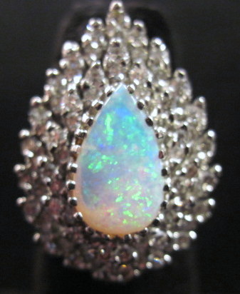 Appraisal: karat white gold diamond and opal cluster ring Pear form