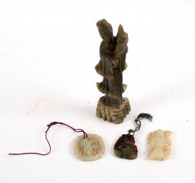 Appraisal: A jade carving of a figure standing by a crane