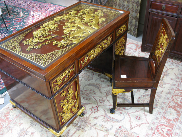 Appraisal: CARVED AND PARCEL-GILT ROSEWOOD DESK WITH MATCHING CHAIR Chinese th