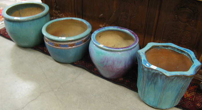 Appraisal: FOUR GLAZED POTTERY FLOWER POTS the four with matching turquoise