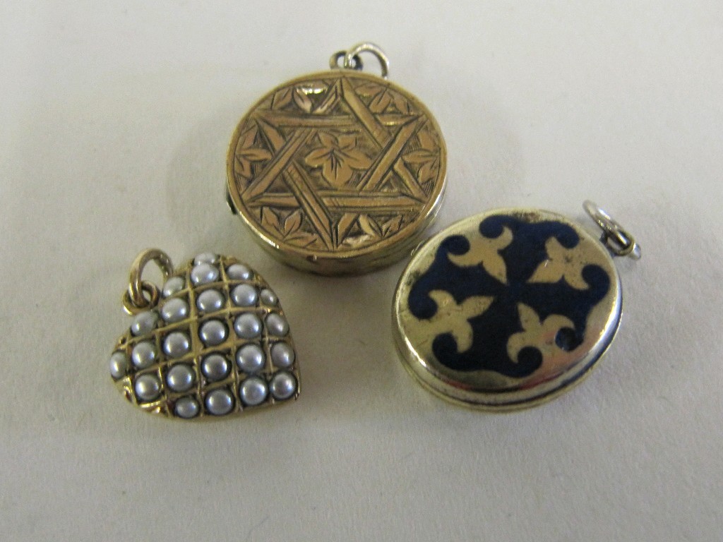 Appraisal: Lot comprising two Victorian yellow metal lockets and a seed