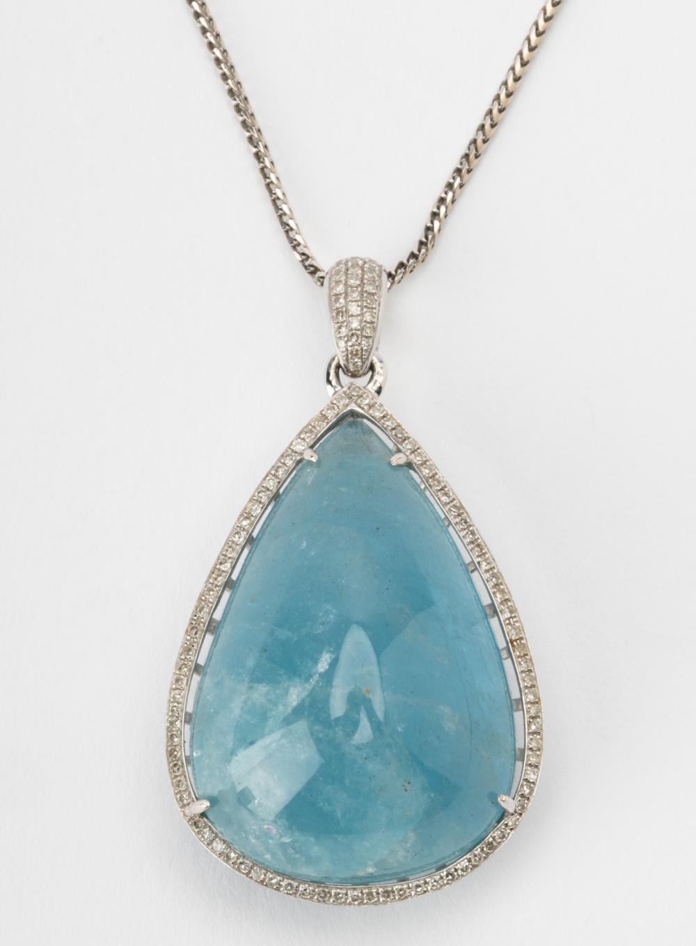 Appraisal: KARAT WHITE GOLD DIAMOND AQUAMARINE PENDANT NECKLACEcentering one pear cabochon-cut