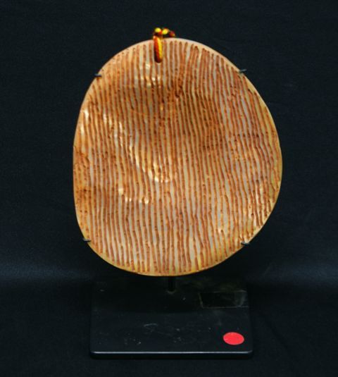 Appraisal: Aubrey Tigan born Honest Man ochre carving on pearl shell