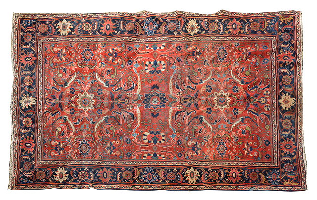 Appraisal: A MAHAL RUST GROUND CARPET decorated with a central inter