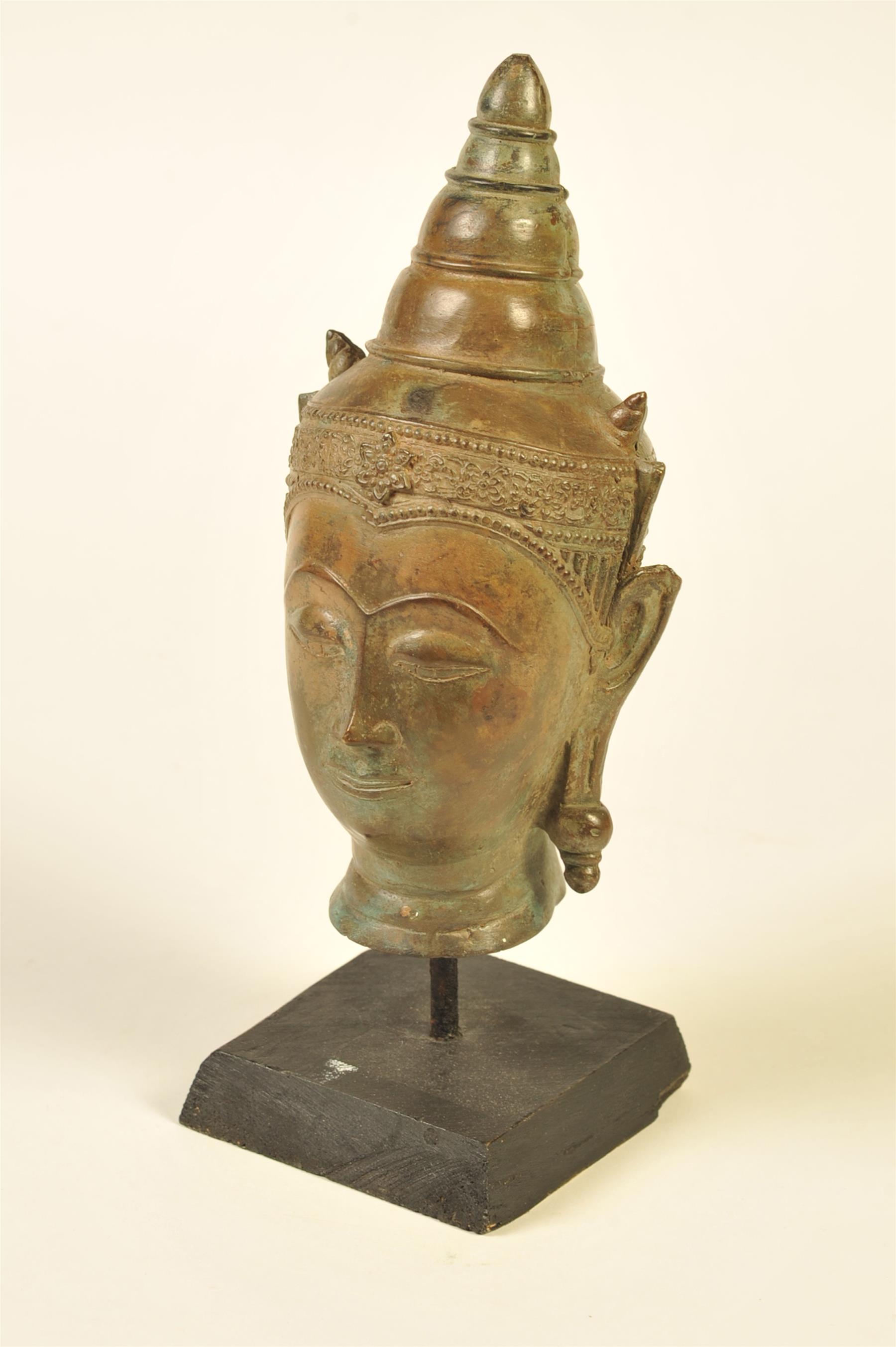 Appraisal: BRONZE BUDDHA HEAD Asia th century Nicely detailed with conical