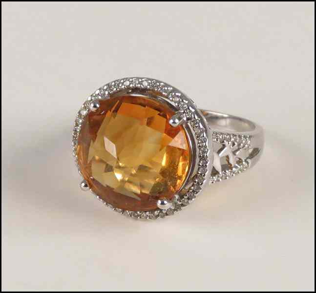 Appraisal: CITRINE DIAMOND AND KARAT WHITE GOLD RING Faceted round cut