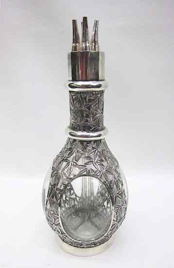 Appraisal: SILVER OVERLAY GLASS FOUR PART DECANTER the fine silver in