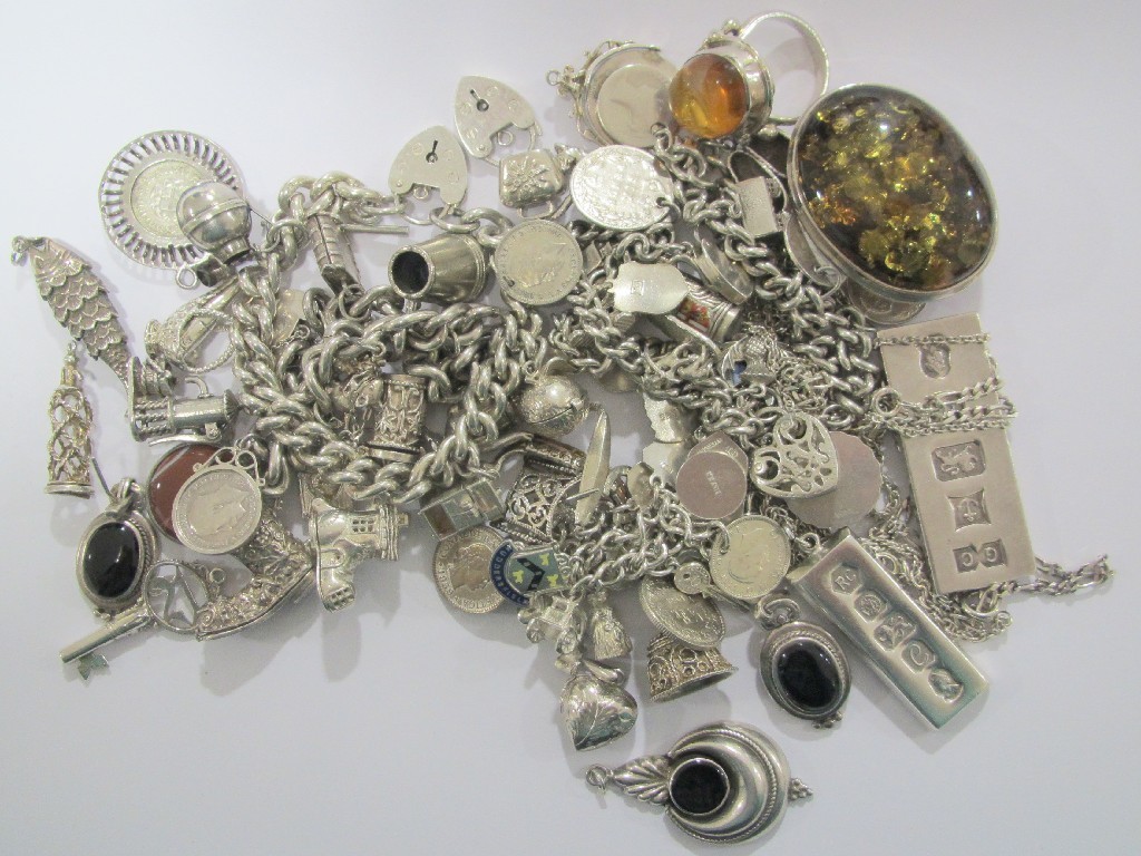 Appraisal: A lot of silver jewellery to include charm bracelets amber