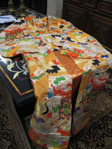 Appraisal: A JAPANESE SILK WEDDING KIMONO elaborately embroidered and multi-colored measuring