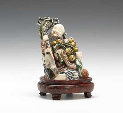 Appraisal: A Carved Ivory Figure of the God of Longevity Seated