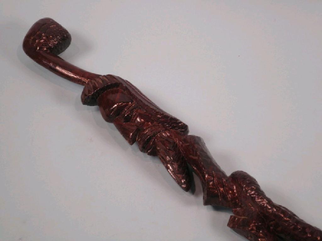 Appraisal: An African hardwood walking stick in the form of a