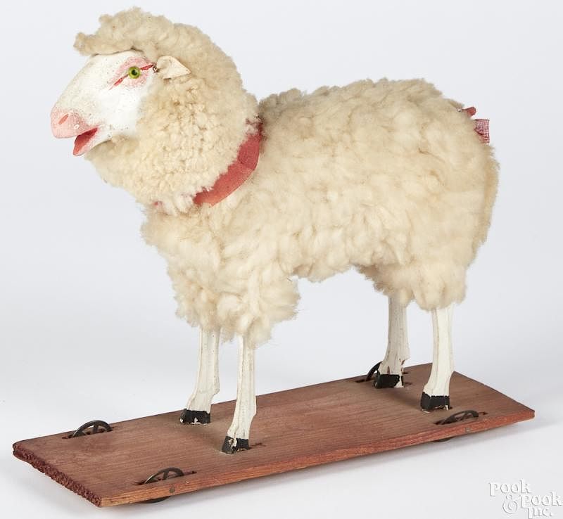 Appraisal: Stick leg sheep on platform pull toy Stick leg sheep