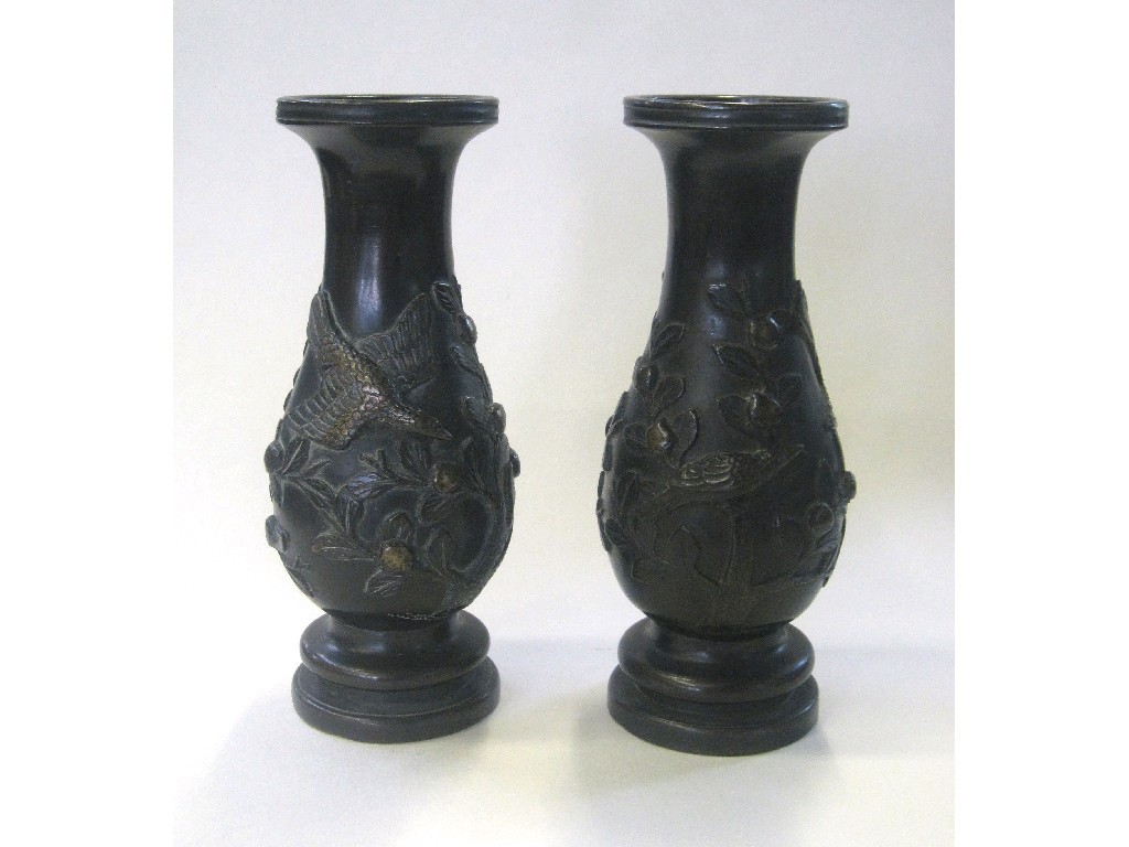 Appraisal: Pair of oriental bronze vases with relief decoration of birds